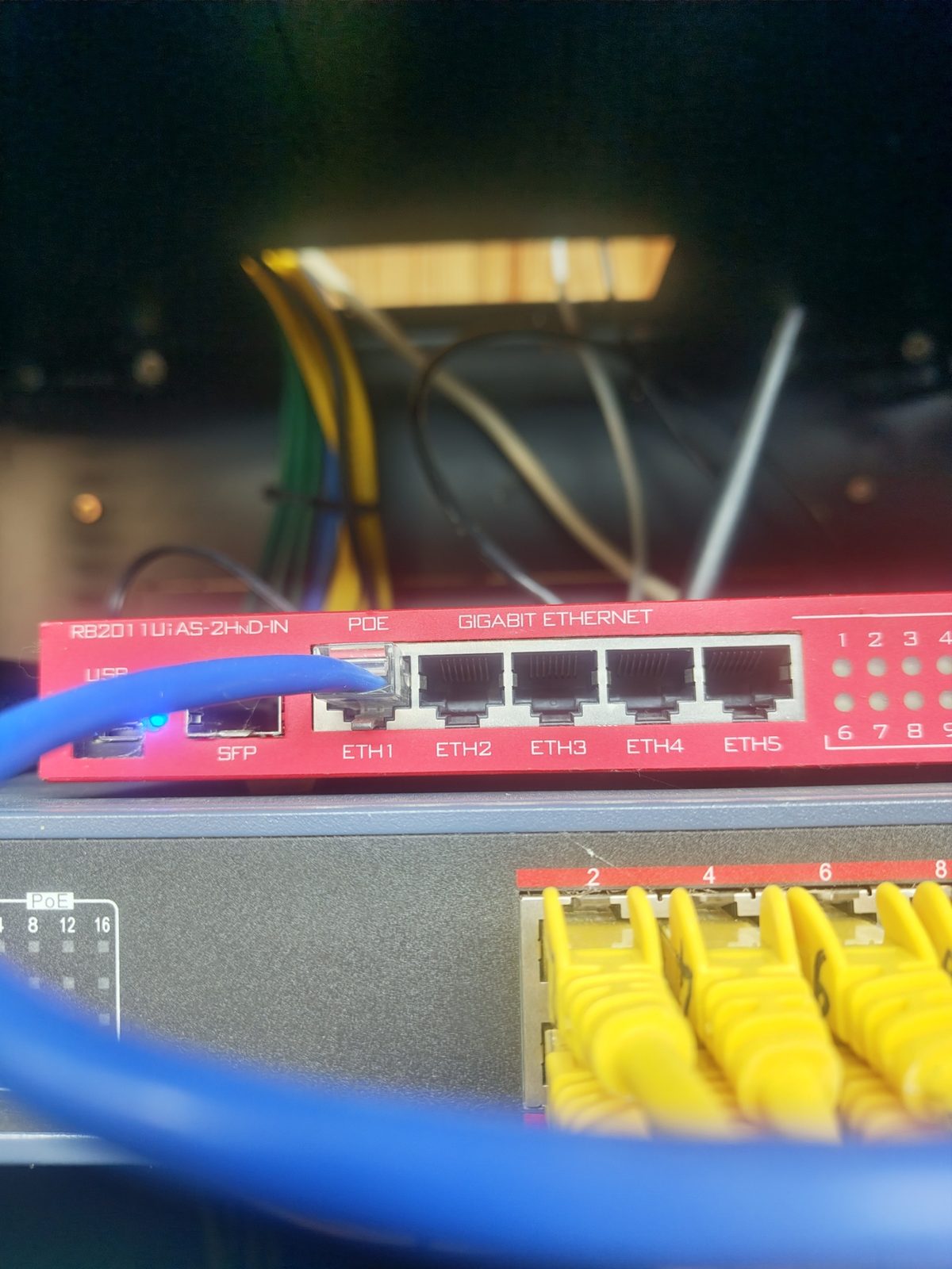 MikroTik router and PoE switch with patch cables installed by KMAC